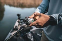 Quantum Energy S3 Baitcasting Reel -Fishing Products Store energy bc reel and rod closeup lifestyle